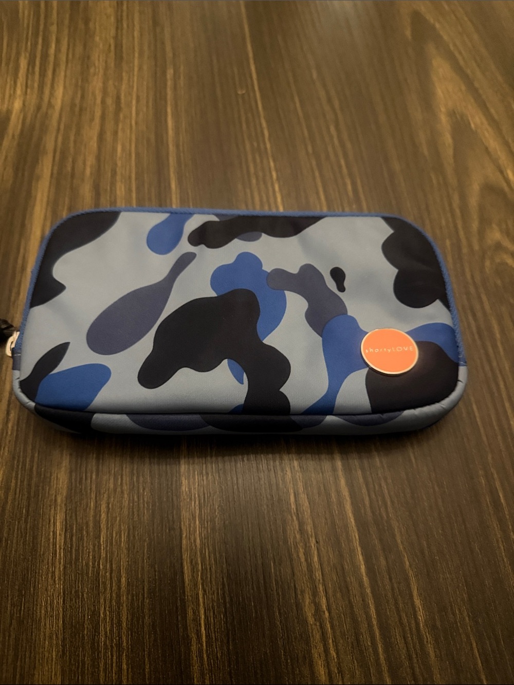 Blue Camo Zip Pouch with Orange Logo Accent
